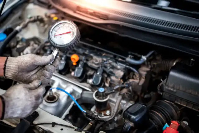 What should the proper compression pressure be in a gasoline engine?