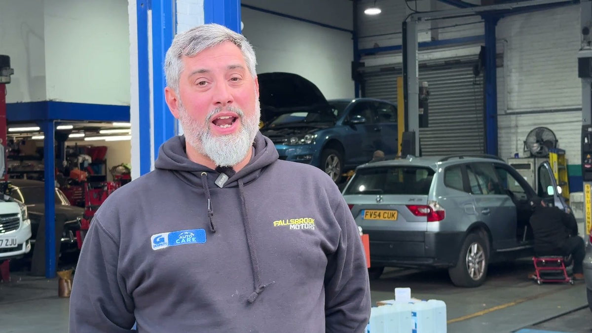 Simon, who runs Fallsbrook Motors in Streatham, in his workshop